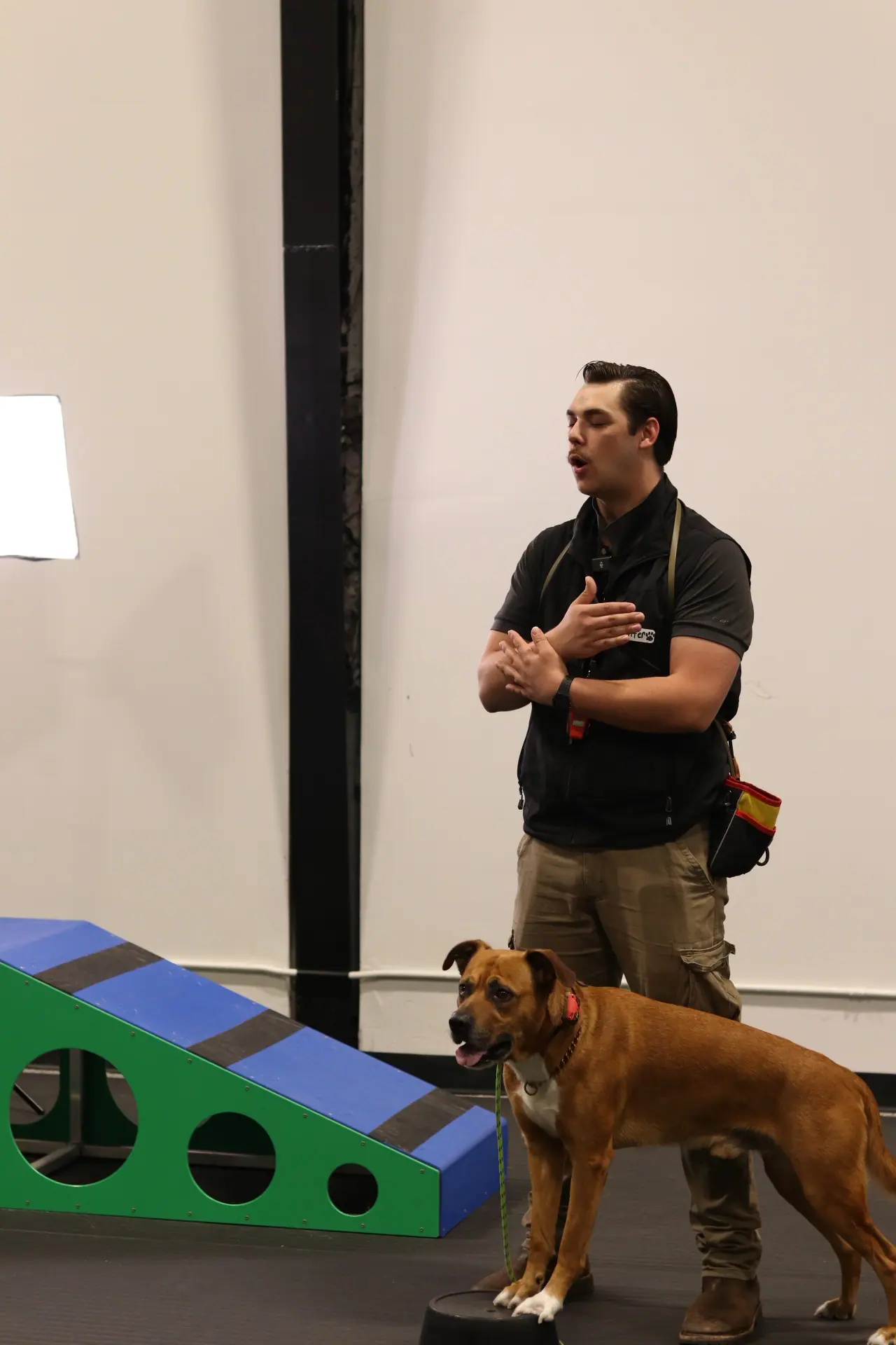 Hunter guiding a dog during a training session